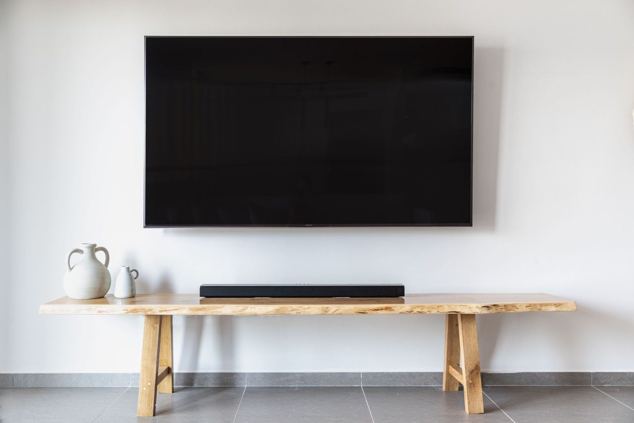 A wall-mounted TV with hidden cables